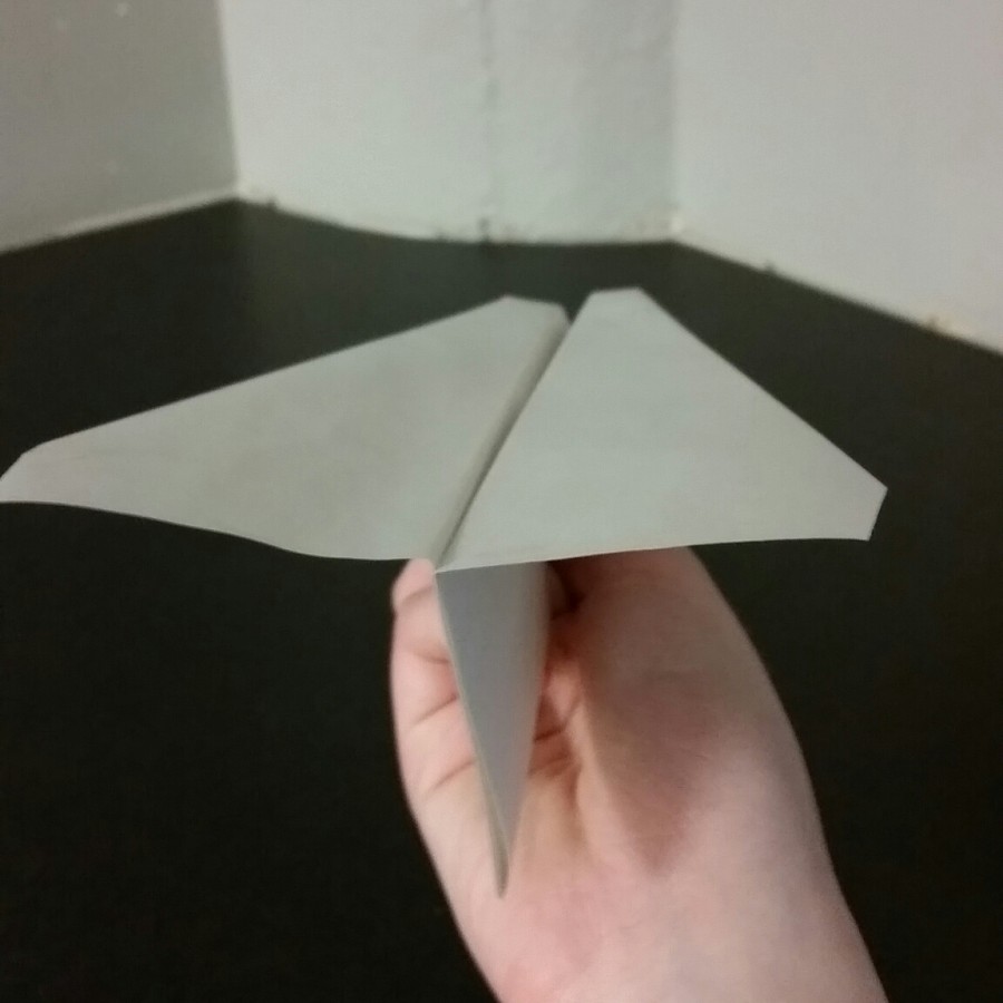 Step 7: Pull the wings back up so that they are perpendicular with the center part of the plane.