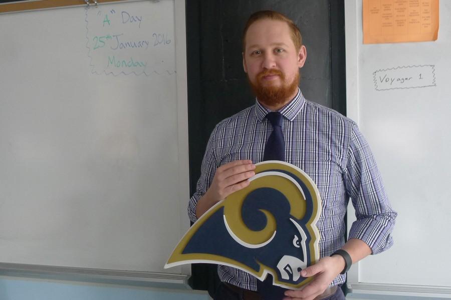 Michael Mancuso, Algebra 1B and 2 instructor, holds Rams logo in hands. Mancuso tells about his 25 years of experience in St. Louis, and how he is somewhat saddened about the transfer of the Rams. 