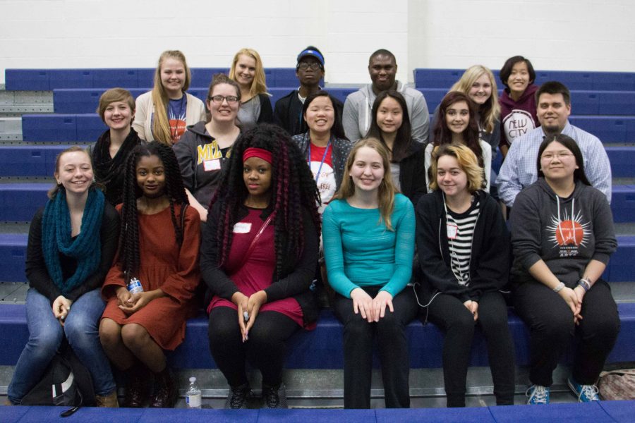 GCAA Student Media, and adviser Travis Armknecht, sit in the bleachers in the Webster University gymnasium. Students attended multiple workshops throughout the day to enrich their skills in journalism. 
