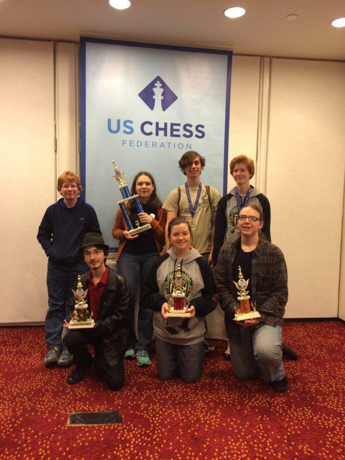 Chess team poses with trophies after competing. Back row: William Gibert, Lillian Selligman, Isaac Zimmerman, Katlyn Miller.
Front row: Christopher Corriveau, Sophie Brieler, Galen Selligman.