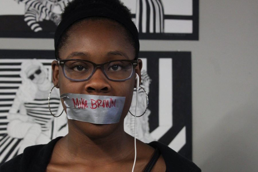 Elizabeth Reed, freshman, participates in a silent protest on Friday, September 30th, in support of the Black Lives Matter movement. Students wrote names of those killed by police on pieces of duct tape that were worn on their mouths for the entire first class of school.