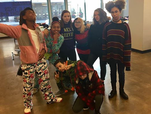 Back (left to right): Aireyona Stewart, Afiya Faatuona, Macy Machetta, Lexie Mitev, Lilli Brremerkamp, Kit Daugherty, Jacque Berra. Students pose for a photo during the rummage sale held in the south cafeteria. 