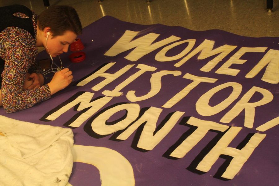 Sophomore Lilliana Bremerkamp works on a poster for the HERstory Museum in art teacher Caitlin Munguias room.