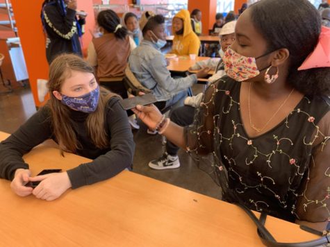 Editor Korissa Smith, senior (right), interviews 6th grader Isabella Meyer during lunch on Sept. 23, 2021.