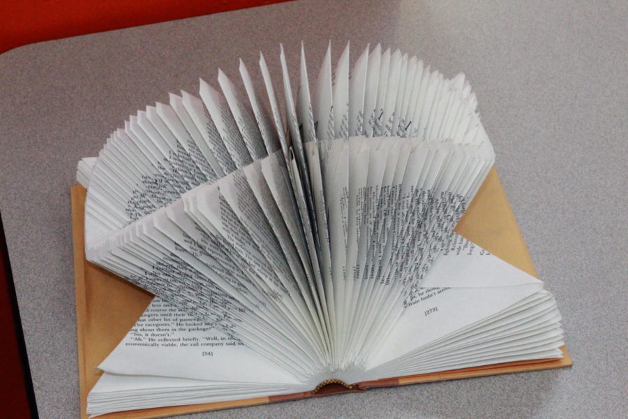 Book pages folded into a 3D piece of art. Made by Unknown.