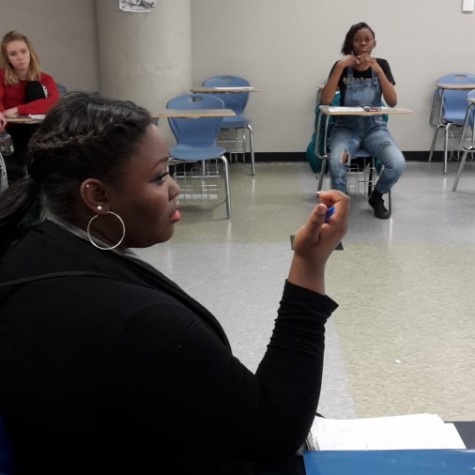 Shaquana Williams leads discussion in the Social Justice Organization about the Department of Justice Report. The group meets once a week after school. 