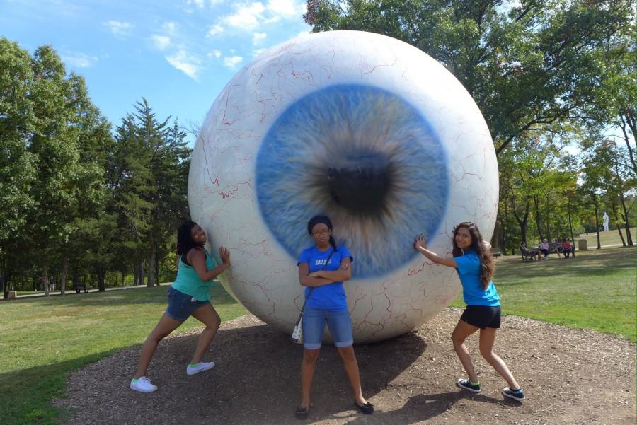 Amber Frost, Kloeamber Harris, and Kaitlyn Davis spend a nice winter day in Laumeier Sculpture Park first stopping at the "Eye." The "Eye" is one of the most popular sculptures in the park, and this one is one that is a little difficult to climb on. 