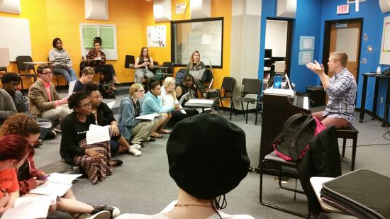 Camerata rehearses songs in the choir room.