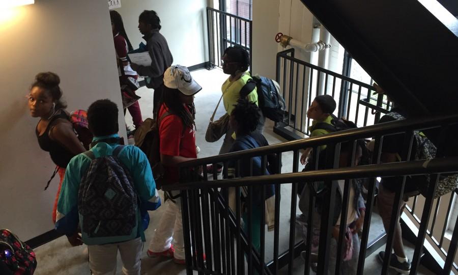 Students move between the third and fourth floors during passing time on September 10, 2015. 