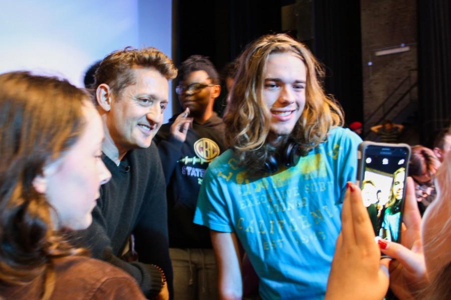 Hunter Holtzman (right) posing for a picture with Alex Winter (center left)