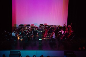 Damen Martin, Instrumental Music/Orchestra, conducts high school orchestra students. Pieces they included performed included Fright Night, Curse of the Rosin Eating Zombies, and Idylls of Pegasus.