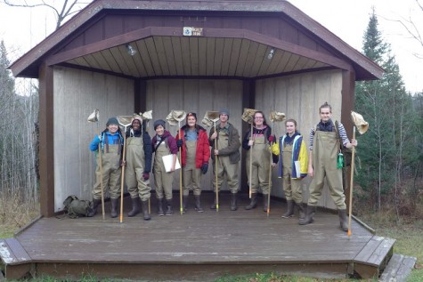 The APES Class are dressed in waders, ready for stream ecology, catching bugs in streams as apart of one of their daily lessons. The nets are used to sift through sand and more dense surfaces to find the bugs. The thing the class is standing on. Mr. Warren originally had that as his desktop wallpaper on his laptop, which was the reason behind the class going to Wisconsin in the first place. 