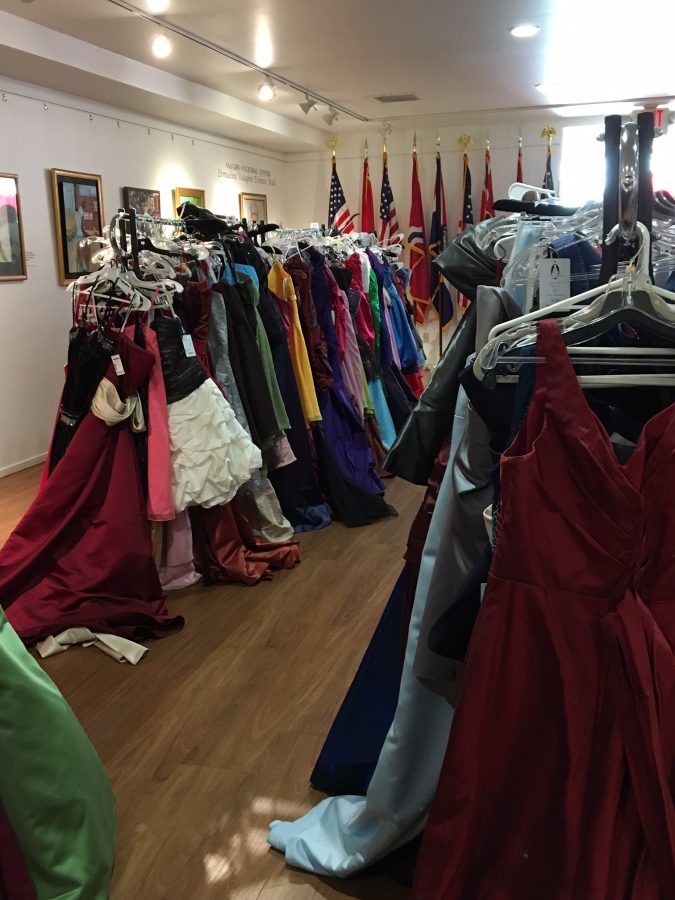 Dresses hang on a rack in the lobby of the Urban League of St. Louis. "It was just a really good bonding experience for a large group of girls and boys that maybe not would have necessarily gone shopping together." said college counselor Erica Snelson. 