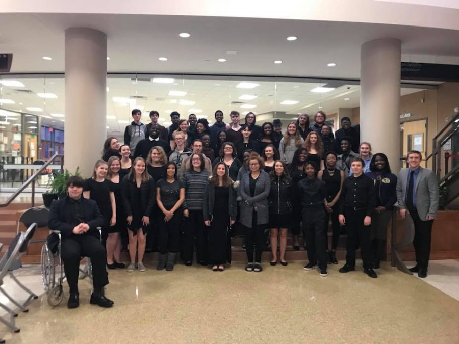 Festival Choir poses for a picture with Wes Smith, vocal music instructor. Festival Choir, Camerata, and Advanced Treble Choir all received ones for their performance. 