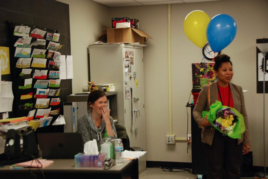 Caitlin Munguia, visual arts teacher, is surprised with balloons and flowers, presented to her by Dr. Candice Carter-Oliver, CEO of Confluence Charter Schools.