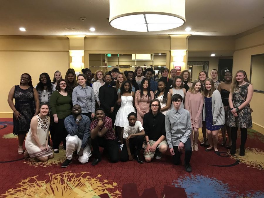 GCAA festival choir posing in the lobby before learning their scores.