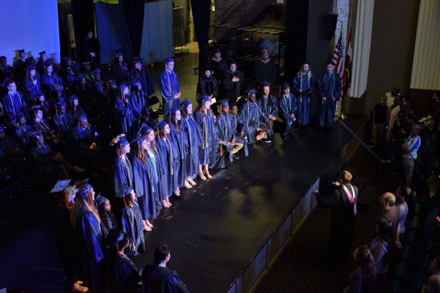 The seniors of the GCAA Choir perform the National Anthem.  All male graduates were asked to remove their caps in honor of the flag.