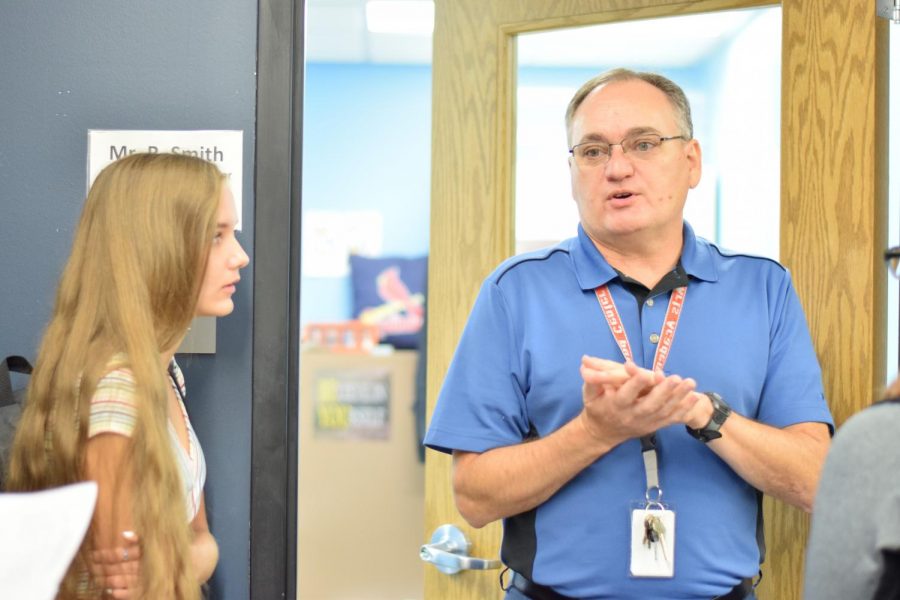 Haley Huson, senior, waits in front of Russel Smith's, counselor, office to fix her schedule. Many students had holes in their schedules, and missed classes while waiting in line to get them fixed.