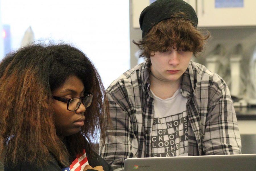 Photo Illustration. Tonia Williams and Orion Yarbrough work on a Chromebook in Makerspace. Williams and Yarbrough are two of several students whose project is a national finalist in the Samsung Solve for Tomorrow contest.