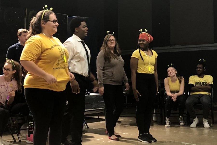 Senior Aurora Philips, theater teacher Brandon Riley, instructional coach Courtney Young, and senior Ayanna Taylor, play an improv activity at improv night on December 13, 2018.