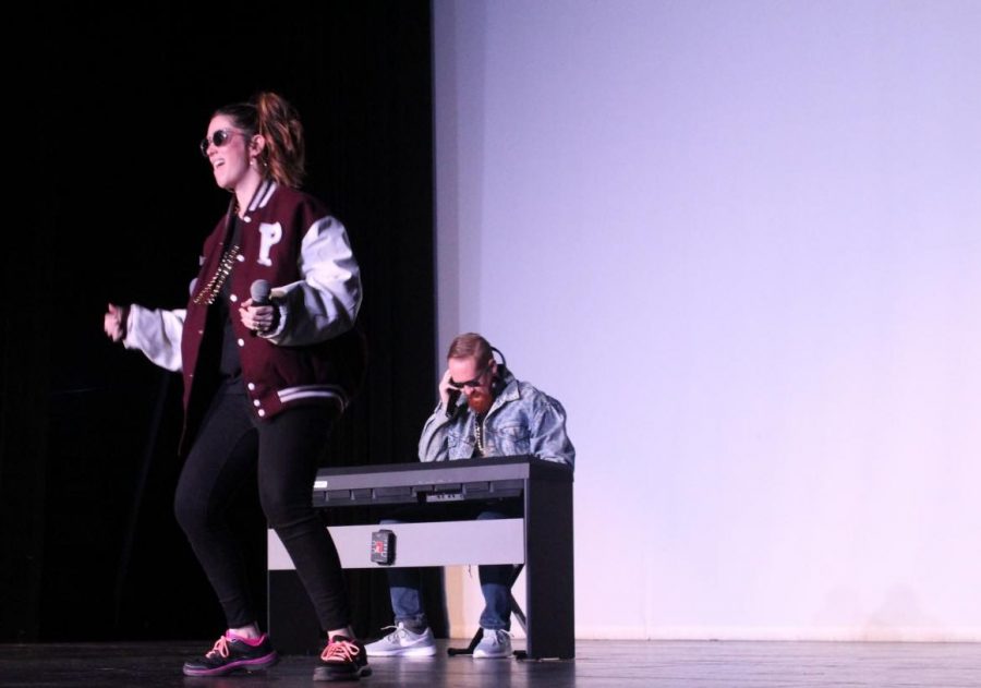 At the lip sync battle in the Sun Theatre, visual art teacher Caitlin Munguia, math teacher Michael Mancuso and (offstage)  counselor Kim Campbell perform to the song 'Push It' by Salt-N-Peppa. “I thought it would be a great way to have the kids see how silly I can be and that we’re just people too. The interaction and comradery it builds. I got to know Ms. Muguia and Mr. Mancuso better so that’s nice for me being new," Campbell said. 