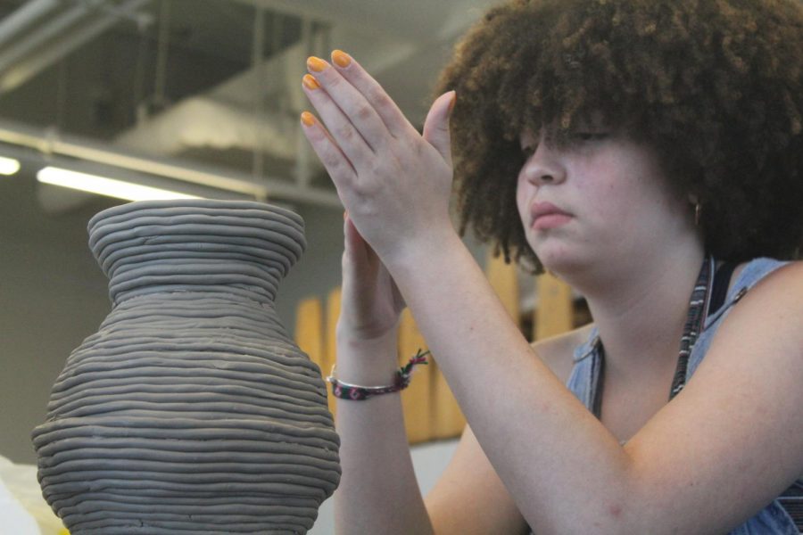 In David Spiguzza's Ceramic 1 class junior, Zadie Connell, works on a pottery project.