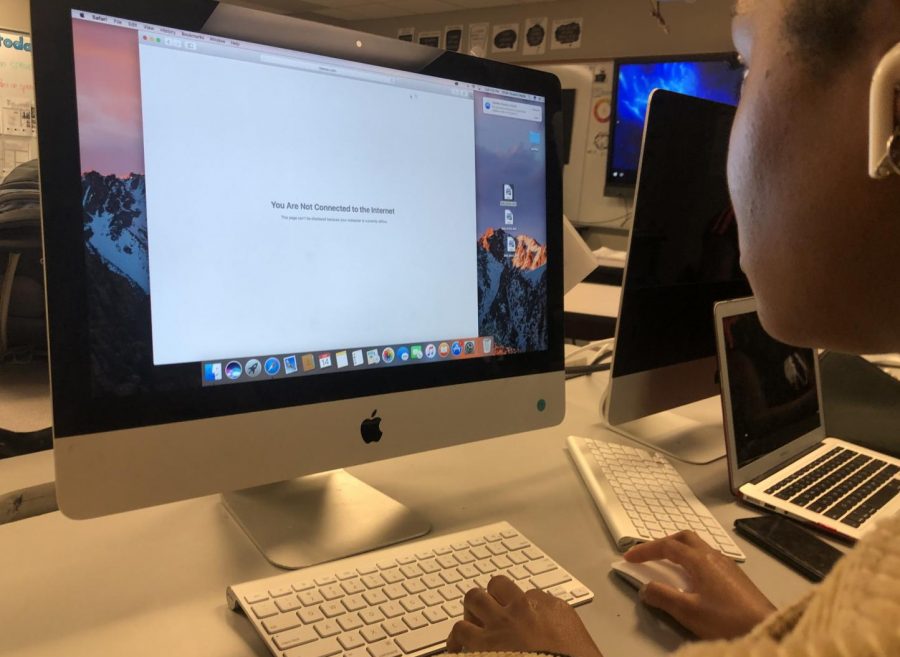 PHOTO ILLUSTRATION: To demonstrate a student losing internet access Jakyah Overton sits at a school computer that states "You Are Not Connected to the Internet." 