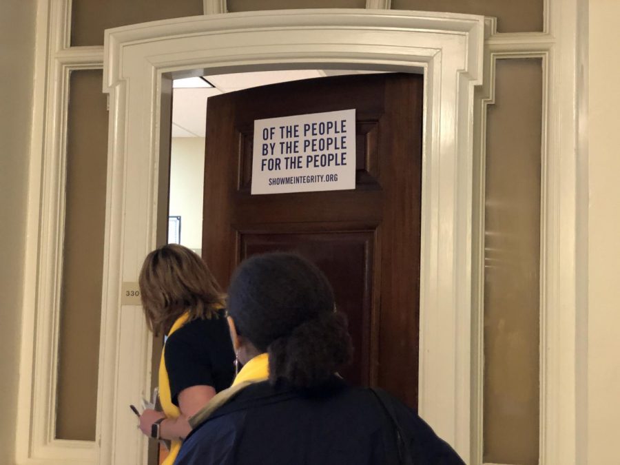 Parent volunteer Sara Irlbeck followed by junior Kit Daugherty go door to door to speak with state representatives relevant to the funding discrepancy issue. 