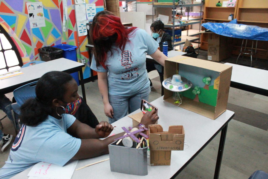 Pauline Rocha and Korissa Smith working on stop motion project.