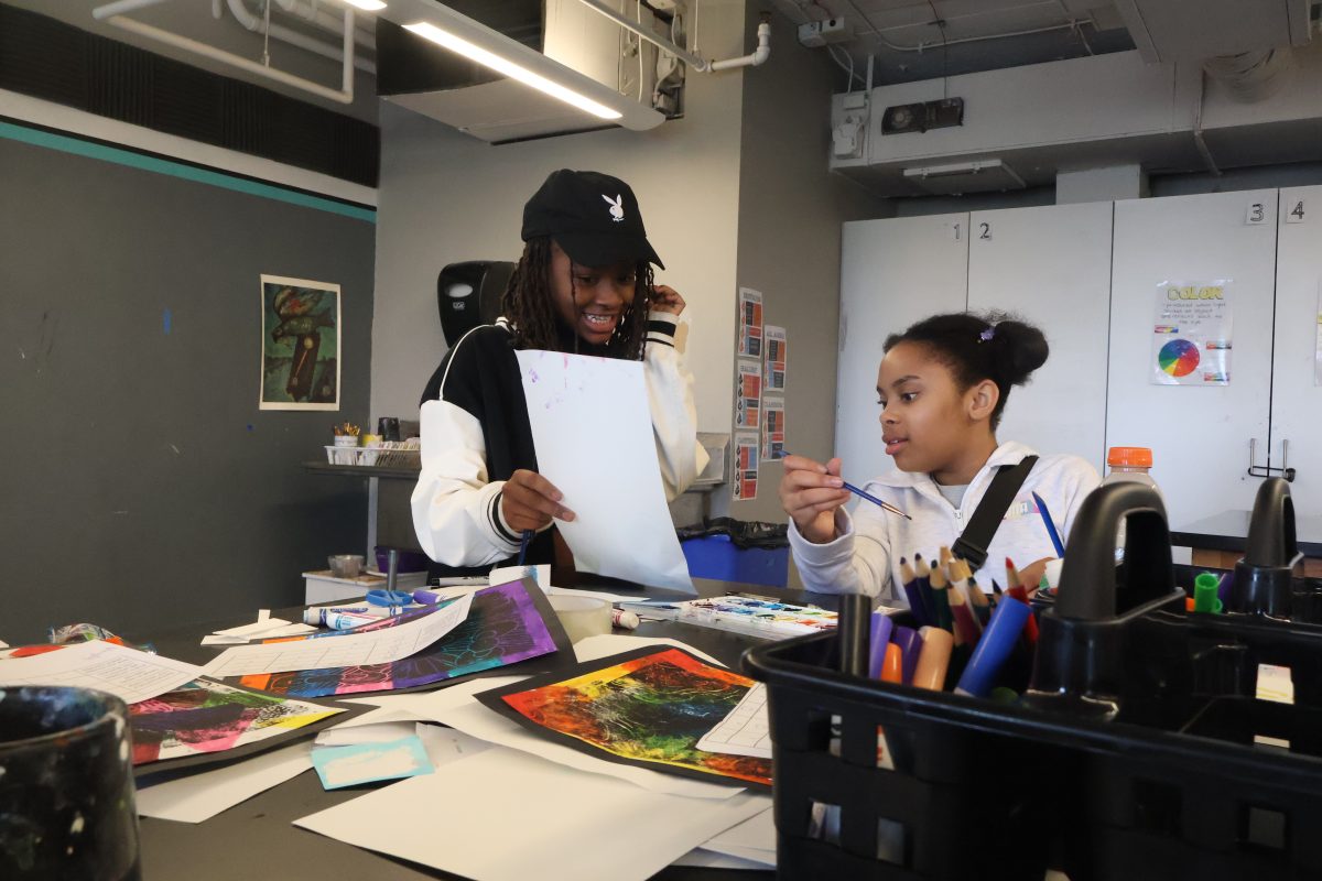 Students Kennedy Hill and Mila Kennedy work on watercolor paintings during the studio art portion of their Exploratory Arts class. 